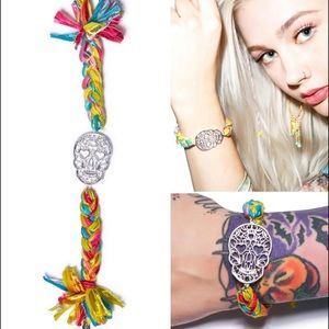 Two DollsKill Ettika Vintage Skull Ribbon Braided Bracelets with Gold Clasps